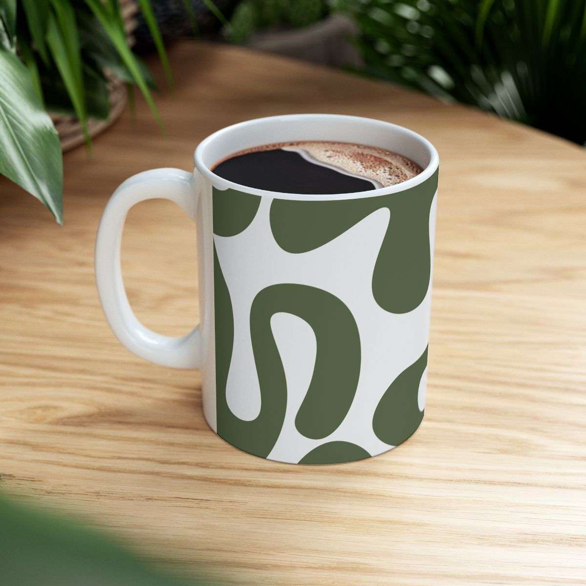 Green And White Animal Print Mug Filled With Coffee