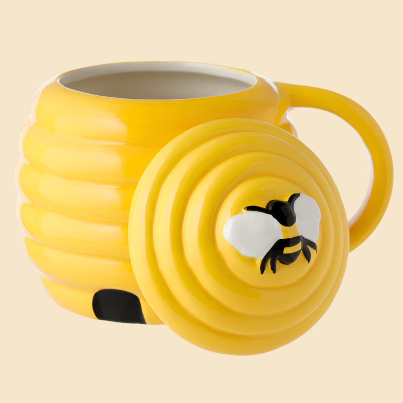 shaped beehive 3d ceramic mug left side view with the lid stood up against the side of the mug